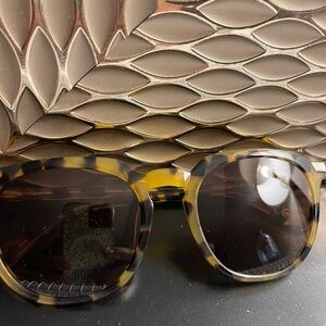 Calvin Klein Brown Sunglasses with Rounded Frames and Dark Lenses